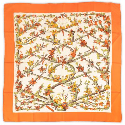 a close up of a square scarf with birds and flowers on it