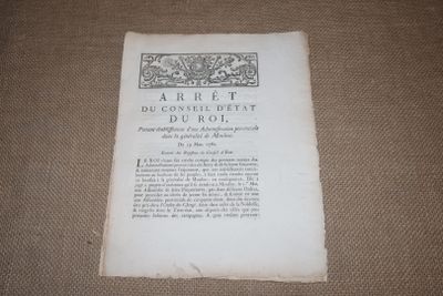 an old book sitting on a table with a black and white picture