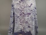 the back of a purple and white floral print jacket on a mannequin mannequin mannequin mannequin mannequin mannequin manne