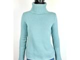 a mannequin mannequin wearing a blue sweater and jeans