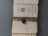 three books that are stacked on top of each other
