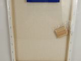 a picture of a picture frame with a piece of wood sticking out of it