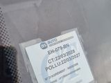 a sticker on the windshield of a car with a sticker attached to it