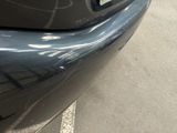 a close up of a car ' s bumper with a sticker on it
