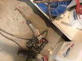 a lot of clutter on the floor of a garage