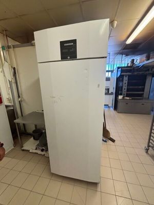 an image of a kitchen with a refrigerator in it