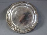 a silver plate that is sitting on a table