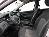 the interior of a small car with a steering wheel and dashboard