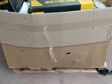 a cardboard box full of electronic equipment sitting on the floor