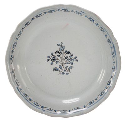 a blue and white plate with a decorative design on it