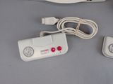 a wii remote and a wii controller next to each other