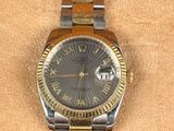 an image of a rolex watch in a box on a table