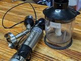 a blender sitting on a wooden table next to a blender