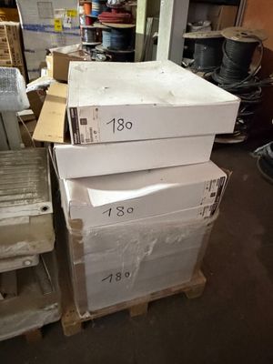 a stack of boxes sitting on top of a pallet in a warehouse