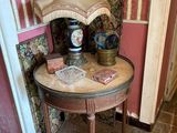a small table with a lamp on top of it