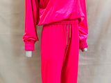a mannequin mannequin wearing a bright pink outfit