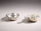 pair of silver plated cups and saucers with handles
