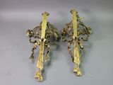 pair of gold plated wall sconces with flowers and leaves