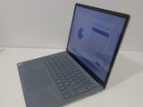 the laptop is sitting on the table with the keyboard open