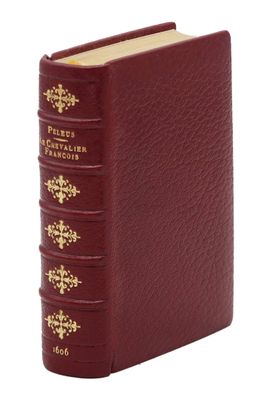 un gros plan d'un livre sur fond blanc, avec une couverture rouge