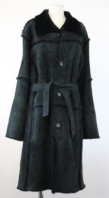 a black coat with a fur collar on a mannequin stand
