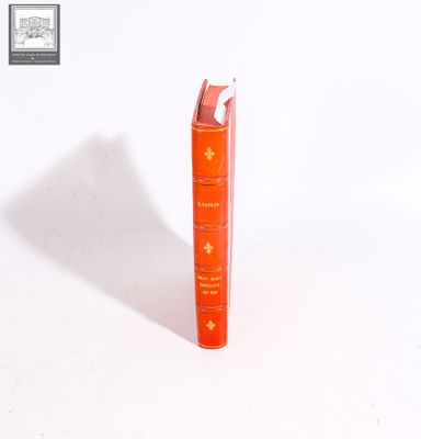 a red book that is sitting on top of a white table