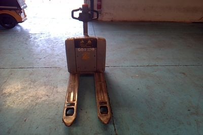 a forklift that is sitting in a garage
