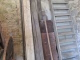 many pieces of wood stacked on the floor in a room