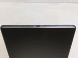 the back of a black laptop computer sitting on top of a table