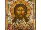une icône représentant le visage de Jésus, accompagnée de nombreux symboles religieux