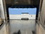 an open oven with a blue tray in it