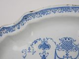 a blue and white plate with a design on it