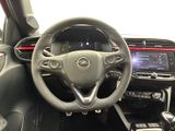 the interior of a car with a steering wheel and dashboard controls