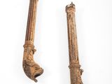 pair of antique cast iron pipe wrens on a white background