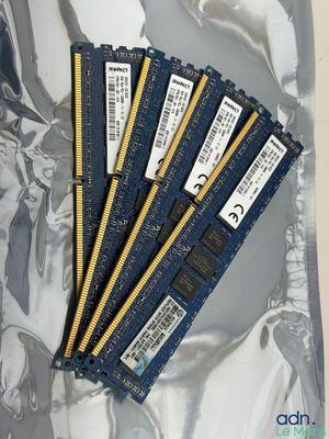 four memory modules are sitting on top of each other on a piece of foil