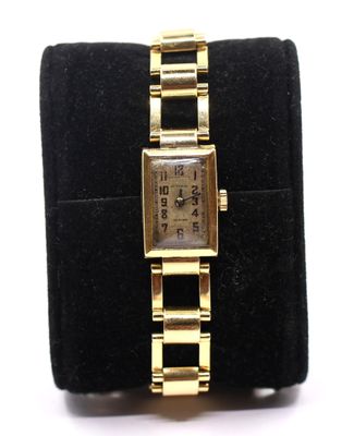a close up of a wrist watch on a display case