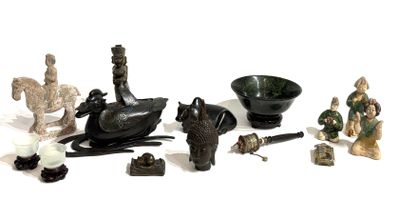 many figurines that are sitting on a white surface