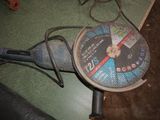 a tennis racket and a tennis ball on the floor