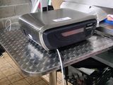 a machine that is sitting on top of an ironing board