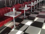 a black and white checkered floor in a diner