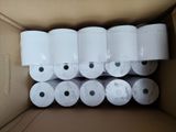 several rolls of toilet paper in a cardboard box on top of a table