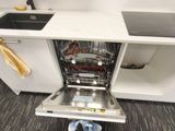 a dishwasher in the middle of a kitchen counter
