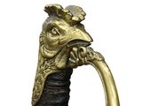 a close up of a gold colored handle on a sword