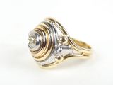 a close up of a gold and silver ring on a white surface
