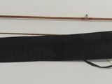 two different types of fishing rods on a table