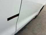 a sticker on the side of a white car that has a sticker on it