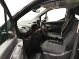 the interior of a car with the door open and the driver ' s seat up