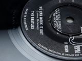 a black and white picture of a record with a label on it