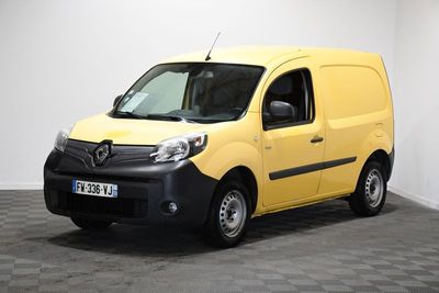 the yellow van is parked in a white room with a checkered floor