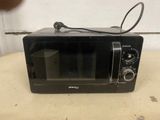 a black toaster oven sitting on a table